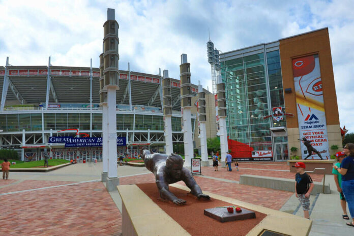 662901022 Baseball stadium entrance with a bronze statue outside.