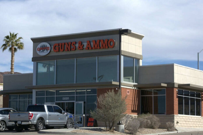 shutterstock2450344471 Guns and ammo store with parking lot.