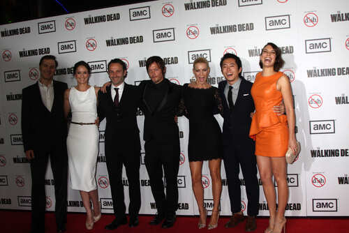 Group of celebrities posing on the red carpet at a Walking Dead premiere