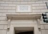 Entrance of the Internal Revenue Service building with a prominent sign