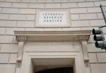 Entrance of the Internal Revenue Service building with a prominent sign