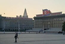 View of government buildings in Pyongyang during sunset