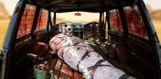 Interior of an abandoned vehicle with a bloodstained wrapped object
