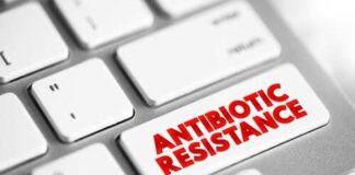 Close-up of a keyboard key labeled 'ANTIBIOTIC RESISTANCE' in bold red letters