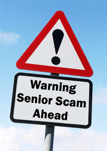 shutterstock_264937559.jpg Warning sign indicating potential scams targeting seniors