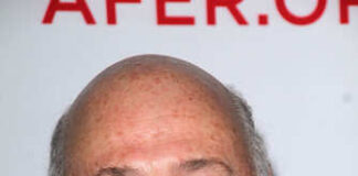 Smiling man with a beard at an event