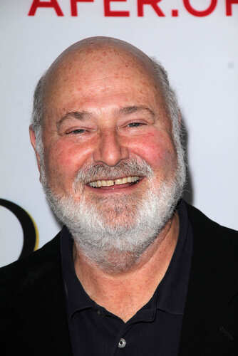 shutterstock_100711825.jpg Smiling man with a beard at an event