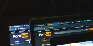 Multiple devices displaying a popular adult website