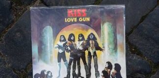 KISS 'Love Gun' album cover featuring band members in elaborate costumes