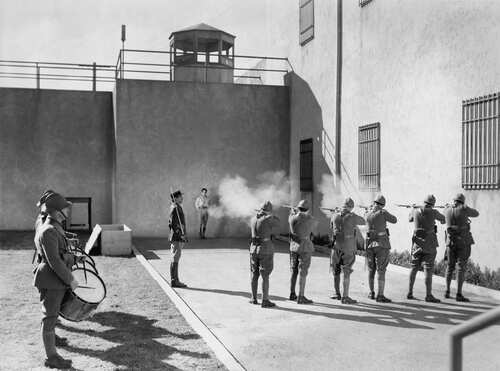 A historical scene depicting a military firing squad preparing to execute a prisoner