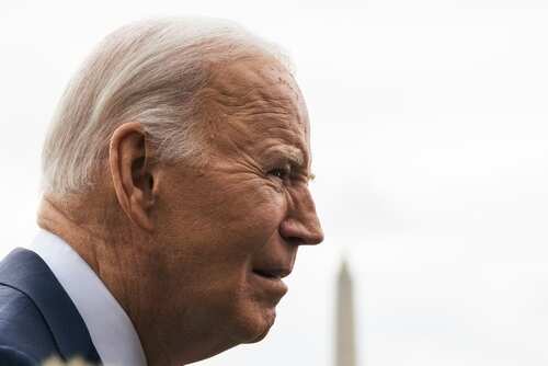 shutterstock_2430068477 (2).jpg Profile view of a political figure outdoors with the Washington Monument in the background