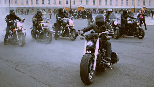 Group of bikers riding motorcycles in an urban area