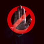 Trump’s Bold Move: Stops China’s U.S. Buying Spree A hand raised in a stop gesture over a prohibition symbol
