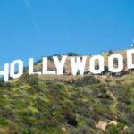 EVICTED—Hollywood Icon Broke! The iconic Hollywood sign on a hillside under a clear blue sky