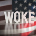 WOKE text over blurred American flag background.