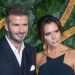 Celebrity couple posing together at a fashion event