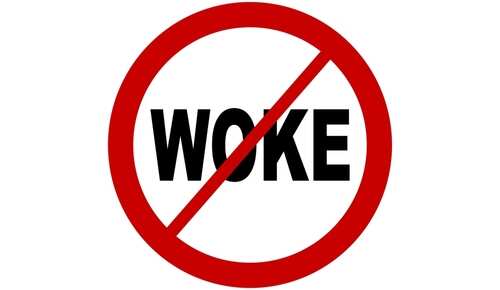 shutterstock_2514468459.jpg A graphic sign with a red circle and a diagonal line over the word 'WOKE'