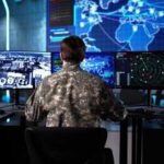 China Nightmare: U.S. Drones Load Up Military personnel monitoring multiple screens in a command center