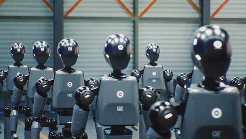 shutterstock_2690849003.jpg Row of humanoid robots standing in a warehouse