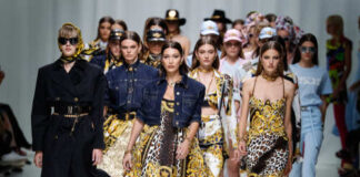 Models walking down the runway showcasing designer outfits