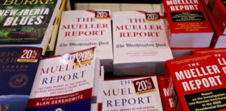 Display of multiple copies of The Mueller Report with discount tags