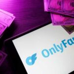 OnlyFans Visa Twist Sparks Outrage OnlyFans logo displayed on a tablet surrounded by cash