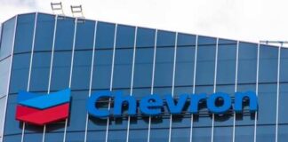 Chevron logo displayed on a modern glass building