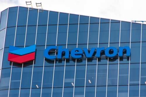 Chevron logo displayed on a modern glass building
