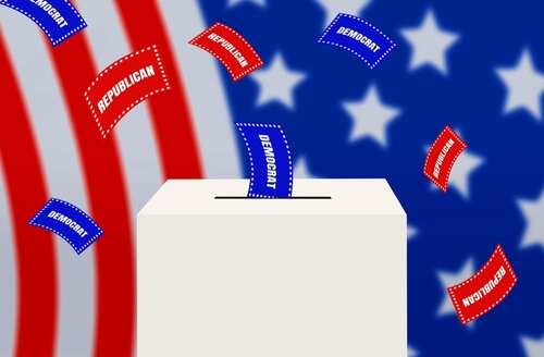 A ballot box with voting slips labeled 'Republican' and 'Democrat' against a backdrop of the American flag