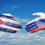 Russian Tanker Dares Trump Off Cuba Hands painted with the Cuban and Russian flags reaching towards each other