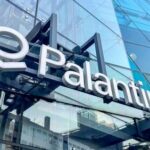 Exterior view of the Palantir office building with a glass facade