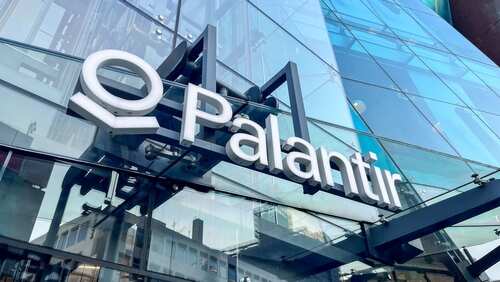 Exterior view of the Palantir office building with a glass facade