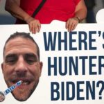 A protest sign asking 'WHERE'S HUNTER BIDEN' with a large photo of a man