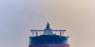 Large cargo ship navigating through the ocean