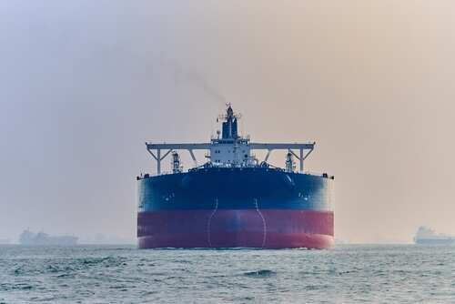 shutterstock_2492496761.jpg Large cargo ship navigating through the ocean