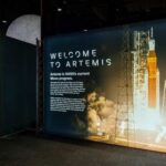 Exhibition display about NASA's Artemis program with a rocket image