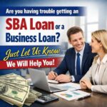 Two professionals discussing loan options at a desk with money in the foreground