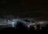 1,000-Year Storm Claim COLLIDES With Records A dramatic lightning storm illuminating the night sky