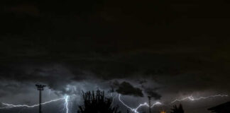 A dramatic lightning storm illuminating the night sky