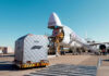 Qatar’s Last-Ditch Mediation Effort: Will it Succeed? Cargo airplane being loaded with shipping containers at an airport