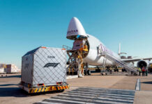 Qatar’s Last-Ditch Mediation Effort: Will it Succeed? Cargo airplane being loaded with shipping containers at an airport