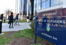 People walking outside Yale School of Management building