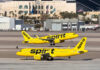 Spirit’s $377M Crowdfund Gamble: Can It Fly? Two yellow Spirit Airlines planes on airport taxiway.