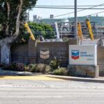 Trump’s Iran Endgame: Will It Crush Oil Prices? Entrance to Chevron El Segundo Refinery with signage