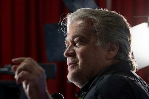 Dallas,,Tx,-,August,4,,2022:,Steve,Bannon,Attends,Cpac Man with gray hair speaking at an indoor event with dramatic lighting