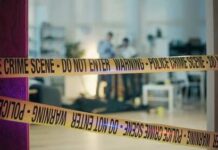 Georgia Teacher’s Shocking Secret Exposed! Police crime scene tape blocking an area with investigators in the background