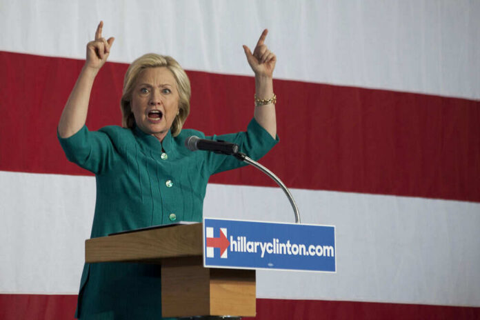 527097199 Person speaking emphatically at podium against striped backdrop