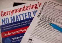 Close-up of election materials including a ballot and informational flyers