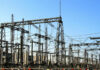Electrical substation with metal towers and wires.