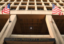 Mayor’s Bluff Meets Constitution Exterior view of the J. Edgar Hoover FBI Building with American flags